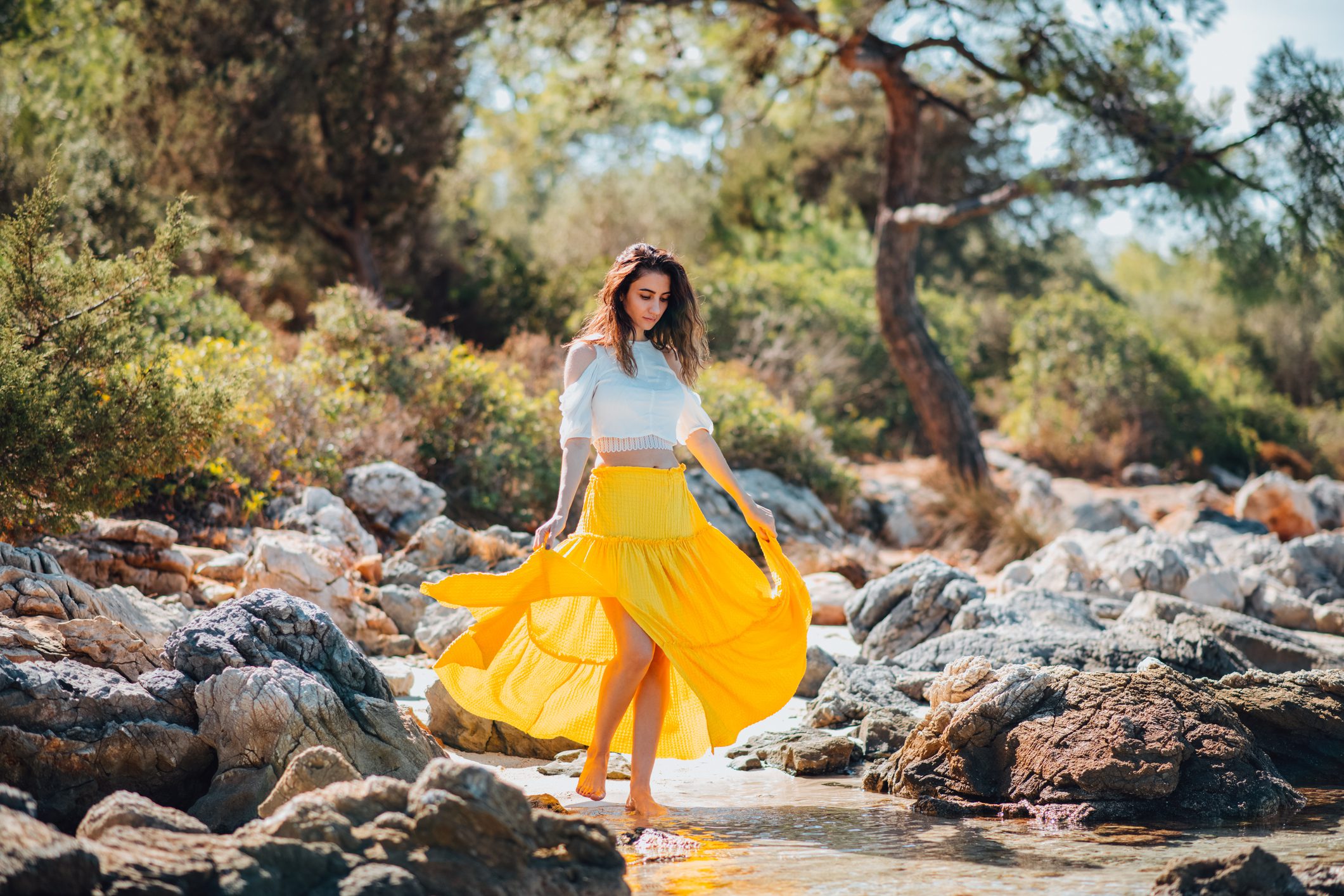 Beautiful Woman in Yellow Dress on the Beach